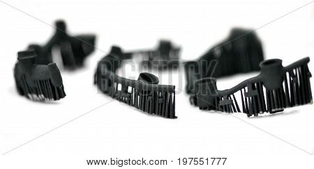 Object denture body printed on a laser sintering machine. Isolated on white background. Close-up.