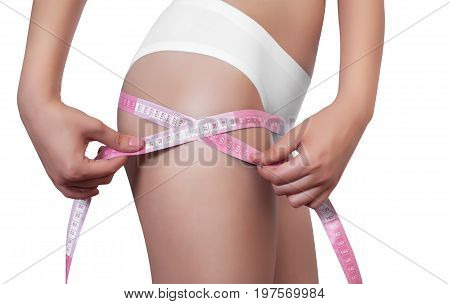 A Thin Woman Measuring Her Hips With A Yellow And Yellow Measuring Tape On A White Isolated Backgrou