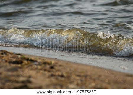 Wave rolling on the sandy shore of the Black Sea, Southern Ukraine