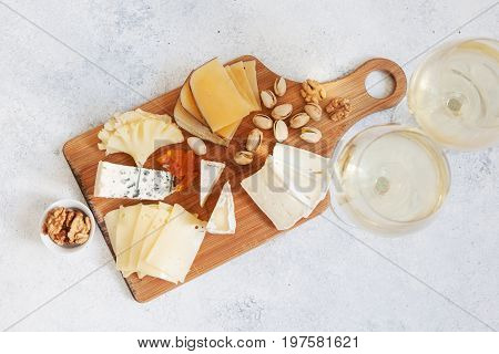 Cheese Plate Served With Grapes, Jam, Cured Melon, Crackers And Nuts