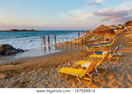 Malia, Crete Island, Greece - June 12, 2017: View Of Beautiful Small Beach During Sunset Near Malia,