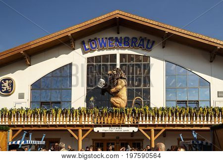 Munich, Germany - September 24, 2016: Facade and entrance of the Loewenbraeu beer tent with people standing in front