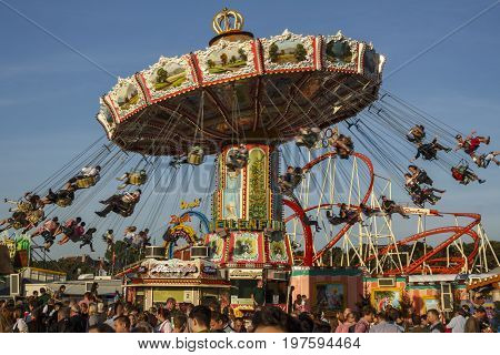 Munich, Germany - September 24, 2016: Carousel in motion with people flying through the air on Theresienwiese