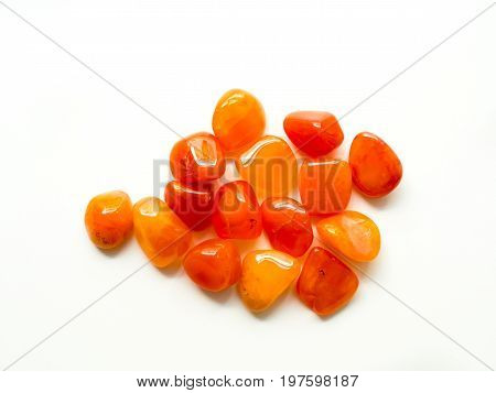 Tumbled Carnelian Stones On White Background For Crystal Therapy Treatments And Reiki