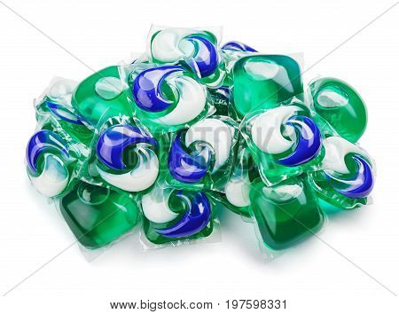 Pile of washing gel capsule pods with laundry detergent isolated on white background with clipping path