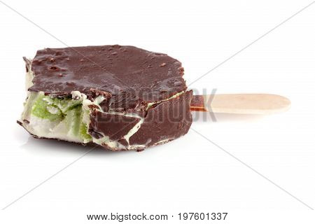 Bitten ice cream in chocolate isolated on white background.