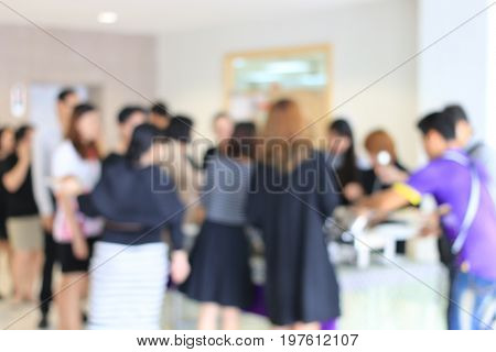 Abstract Blur Image Of Lunch Break Business People In Line Wait For Food Meals. Indoor Catering Food