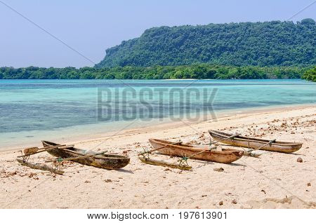 Outrigger canoes in the bay at Port Olry - Espititu Santo Vanuatu
