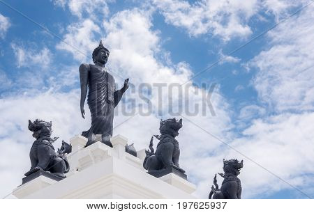 Black Big Buddha Statue With White Cloudy And Blue Sky