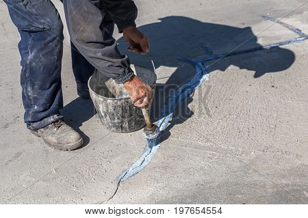 Worker Apply Layer Of Bonding Adhesive 2