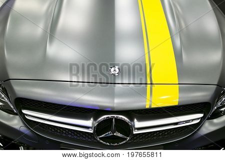 Sankt-Petersburg Russia July 21 2017: Front view of a Mercedes Benz C 63s AMG coupe 2017. Front Headlight. dark Matt colour .Car exterior details. Photo Taken at Royal Auto Show July 21