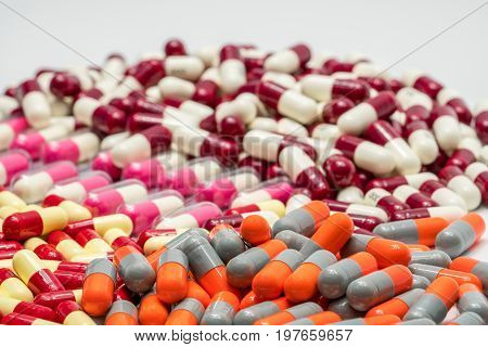 Colorful of antibiotic capsules pills on white background drug resistance
