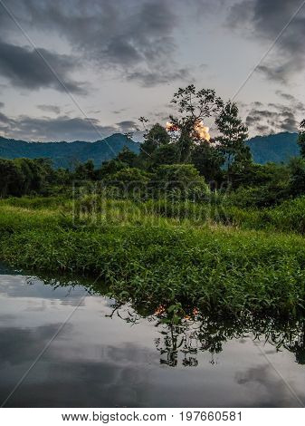 Sunset in the river at Manu National Park Peru