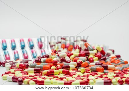 Colorful of antibiotic capsules pills on white background drug resistance
