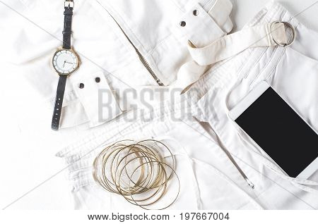 White Womens Clothing And Fashion Accessories On A White Concrete Background