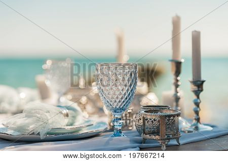 Glasses on the table. Festive table setting. Wedding decor. Table setting in fine art style. Table decor. Catering wedding ceremony selective and soft focus series