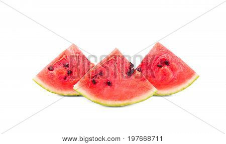 Three appealing slices of fresh and organic watermelon on the white background. Triangular shaped  sharp slices of watermelon show reddish juicy flesh and many tiny black seeds.