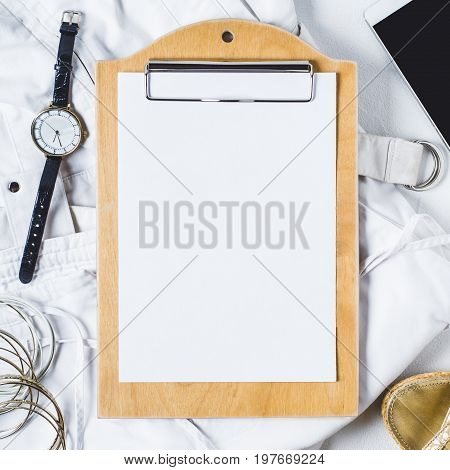 White Womens Clothing And Fashion Accessories On A White Concrete Background