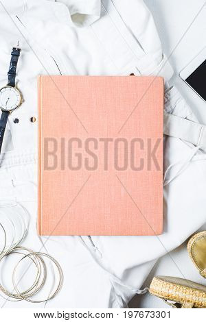 White Womens Clothing And Fashion Accessories On A White Concrete Background