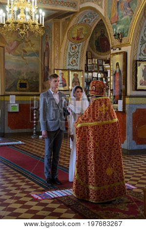 Alchevsk, Ukraine - April 28, 2017: Wedding Ceremony For Newlyweds In The Church