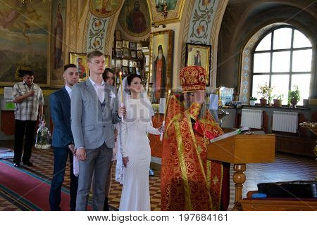 Alchevsk, Ukraine - April 28, 2017: Wedding Ceremony For Newlyweds In The Church