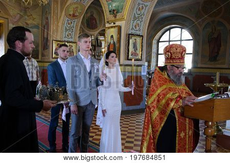 Alchevsk, Ukraine - April 28, 2017: Wedding Ceremony For Newlyweds In The Church