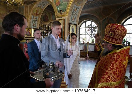 Alchevsk, Ukraine - April 28, 2017: Wedding Ceremony For Newlyweds In The Church