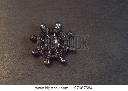Famous Fidget Spinner Stress Relieving N A Black Wooden Background