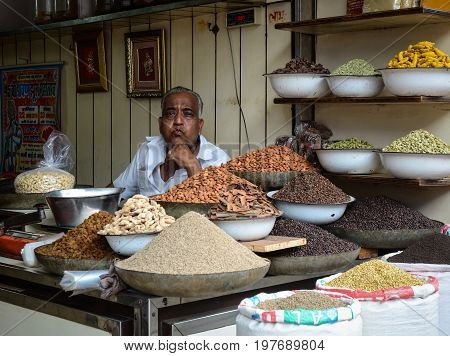 Selling Nuts And Dried Fruits At A Bazaar In India