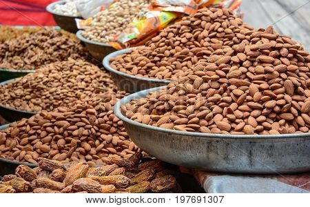 Selling Nuts And Dried Fruits At A Bazaar In India