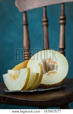 Fresh Sweet Orange Melon On The Wooden Table, Selective Focus And Toned Image