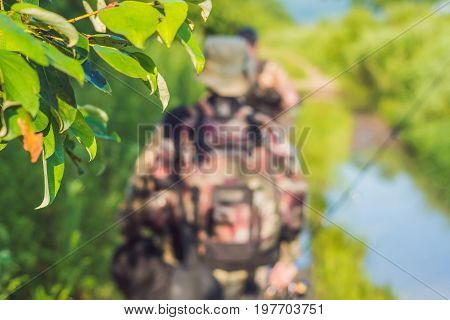 Fishermen Go Fishing With Fishing Rods In Their Hands