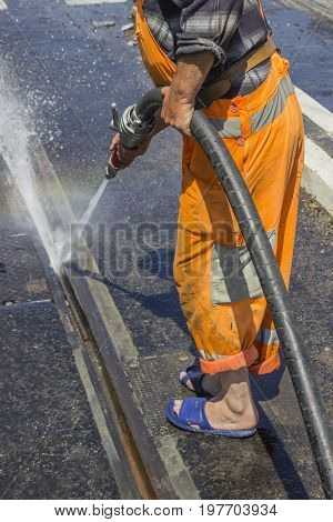 Road Worker Wearing Slippers And Using Water Jet 2