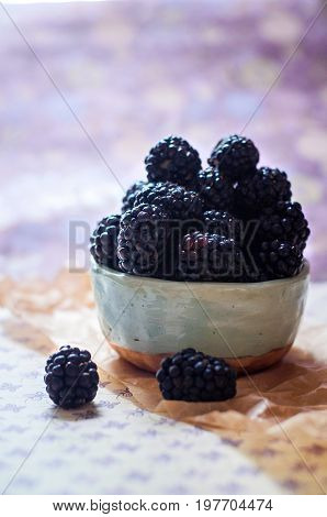 Homemade, sweet, delicious blackberries in a handmade dish