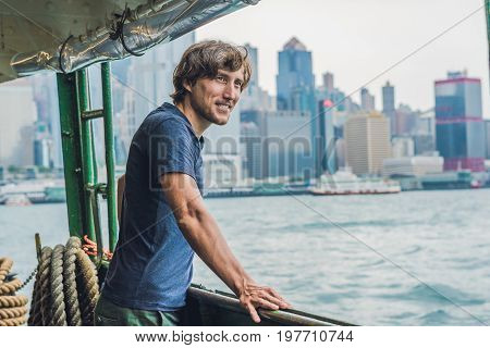 A Young Man On A Ferry In Hong Kong