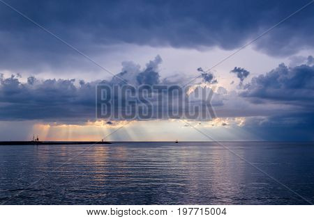 SEASCPAE - Sunset over the sea and storm clouds