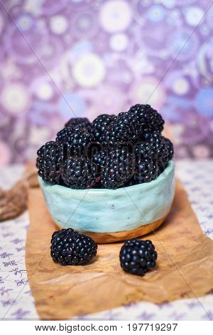 Homemade, sweet, delicious blackberries in a handmade dish
