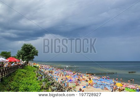 MIELNO, WEST POMERANIAN / POLAND - 2017: Dramatic sky over the holiday sea beach