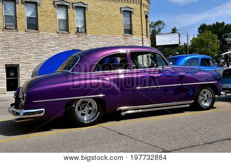CASSELTON, NORTH DAKOTA, July 27, 2017: The annual Casselton Car Show which occurs the last Thursday of July features classic vehicles such as the restored1954 Chevy.