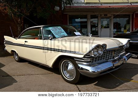 CASSELTON, NORTH DAKOTA, July 27, 2017: The annual Casselton Car Show which occurs the last Thursday of July features classic vehicles such as the  restored 1959 Plymouth Savoy