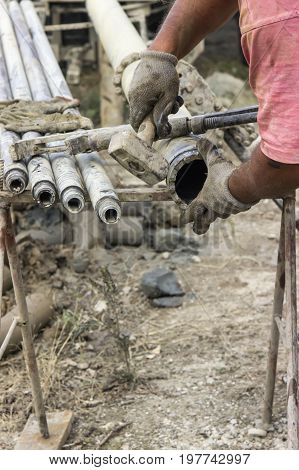 Worker Hands Installing Drilling Bit