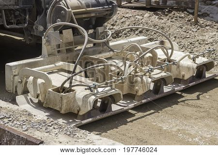 Close Of Plate Compactor Mounted On Truck
