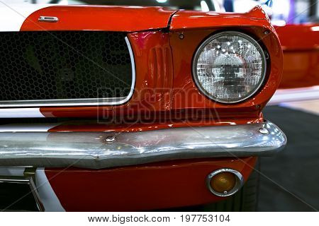 Sankt-Petersburg Russia July 21 2017: Front view of Classic retro Ford Mustang GT.Car exterior details. Headlight of a retro car. Photo Taken on Royal Auto Show July 21