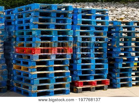 Grid of stacked palettes in the sun