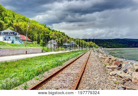 Railroad with Saint Lawrence river in Saint-Irenee Quebec Canada in Charlevoix region