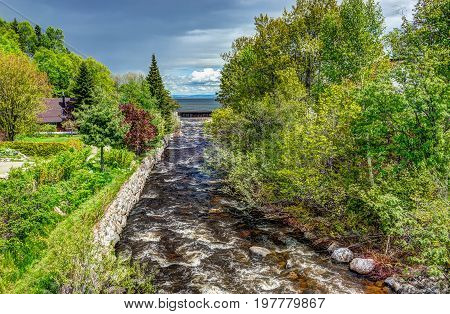 Saint Lawrence river with inland creek in Saint-Irenee Quebec Canada in Charlevoix region