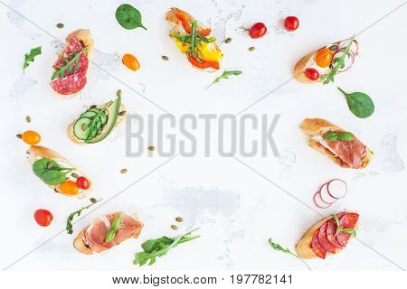 Traditional spanish tapas on white table. Brushetta set. Flat lay top view copy space