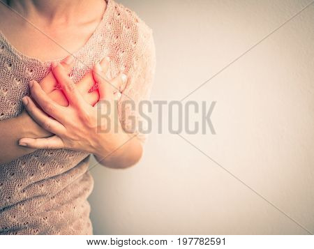 Woman having a pain in the heart attact. Medical and health care concept.