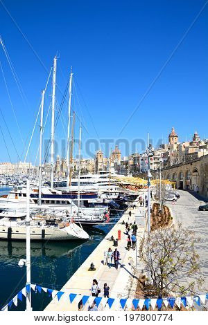 VITTORIOSA, MALTA - MARCH 31, 2017 - Elevated view of Vittoriosa marina and waterfront with views towards Valletta Vittoriosa (Birgu) Malta Europe, March 31, 2017.