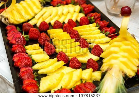 Heap of fresh fruits and vegetables on table close up.